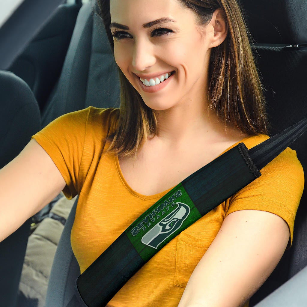 American Football Team Seat Belt Covers - Seattle Seahawks Head On Green Wooden Wall Belt Covers