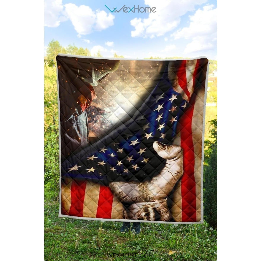 Welder Hand Pulling American Flag Quilt