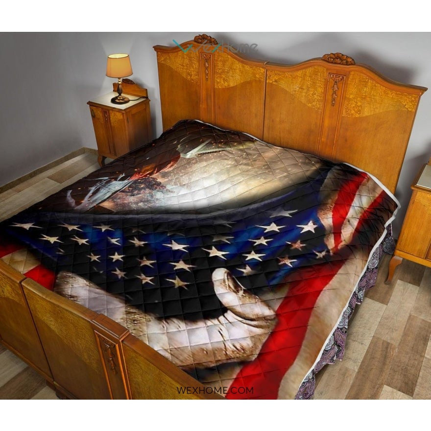Welder Hand Pulling American Flag Quilt