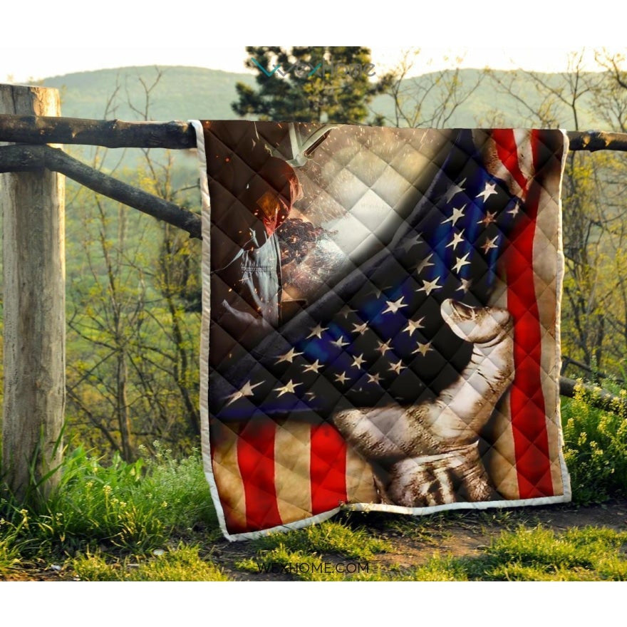 Welder Hand Pulling American Flag Quilt