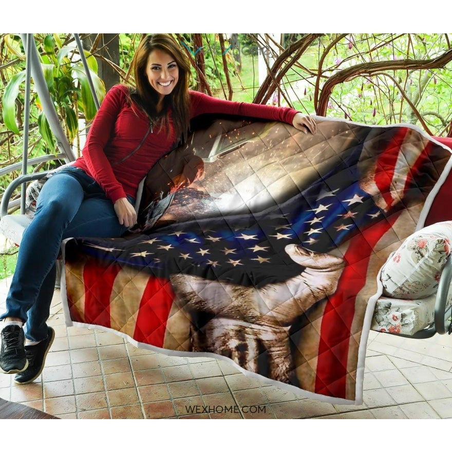 Welder Hand Pulling American Flag Quilt