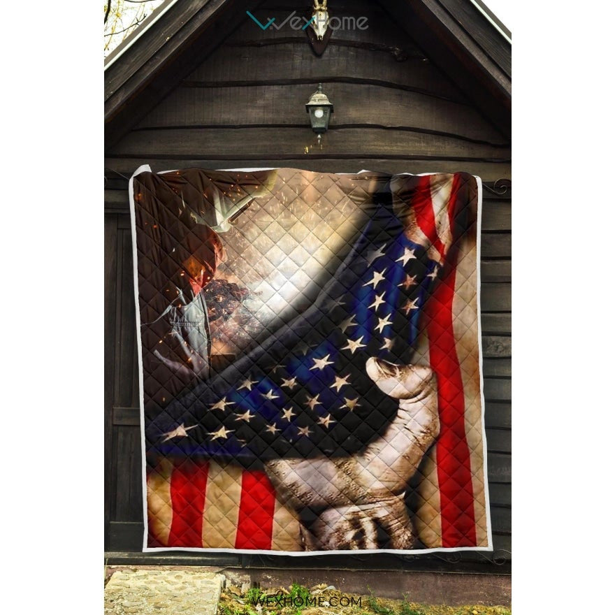 Welder Hand Pulling American Flag Quilt