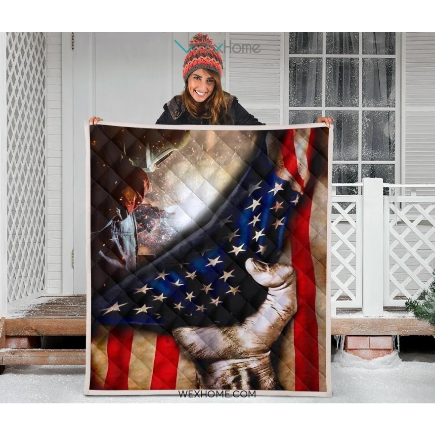Welder Hand Pulling American Flag Quilt