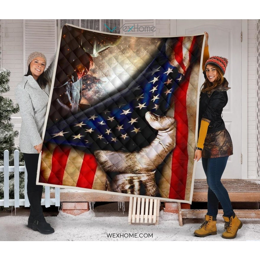 Welder Hand Pulling American Flag Quilt