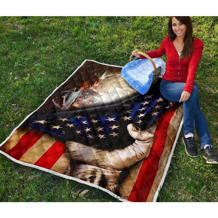 Welder Hand Pulling American Flag Quilt