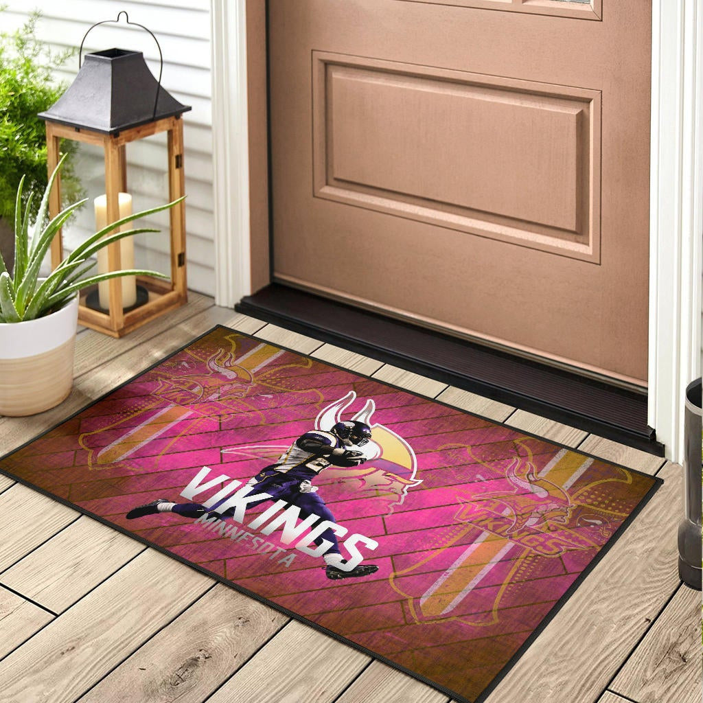 Minnesota Vikings American Football Team Door Mat Adrian Peterson Jumping Symbol On Pink Wall Background Door Mat Home Decor