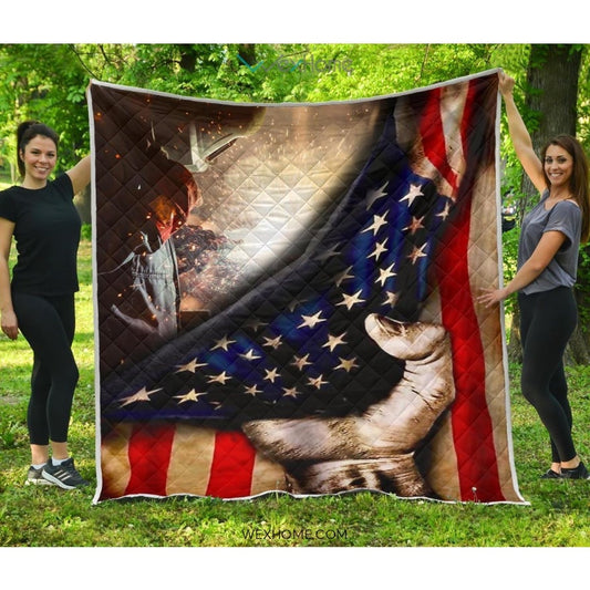 Welder Hand Pulling American Flag Quilt